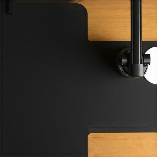 Close-up of a boom arm clamp with rubber padding on a desk mat for vibration reduction.